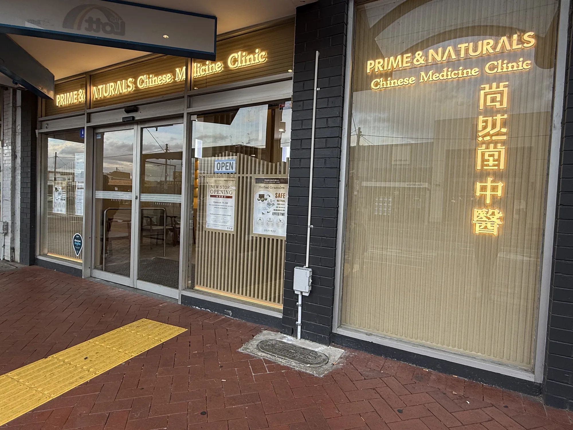 Prime & Naturals shopfront from the footpath — OPEN sign visible in the clinic window