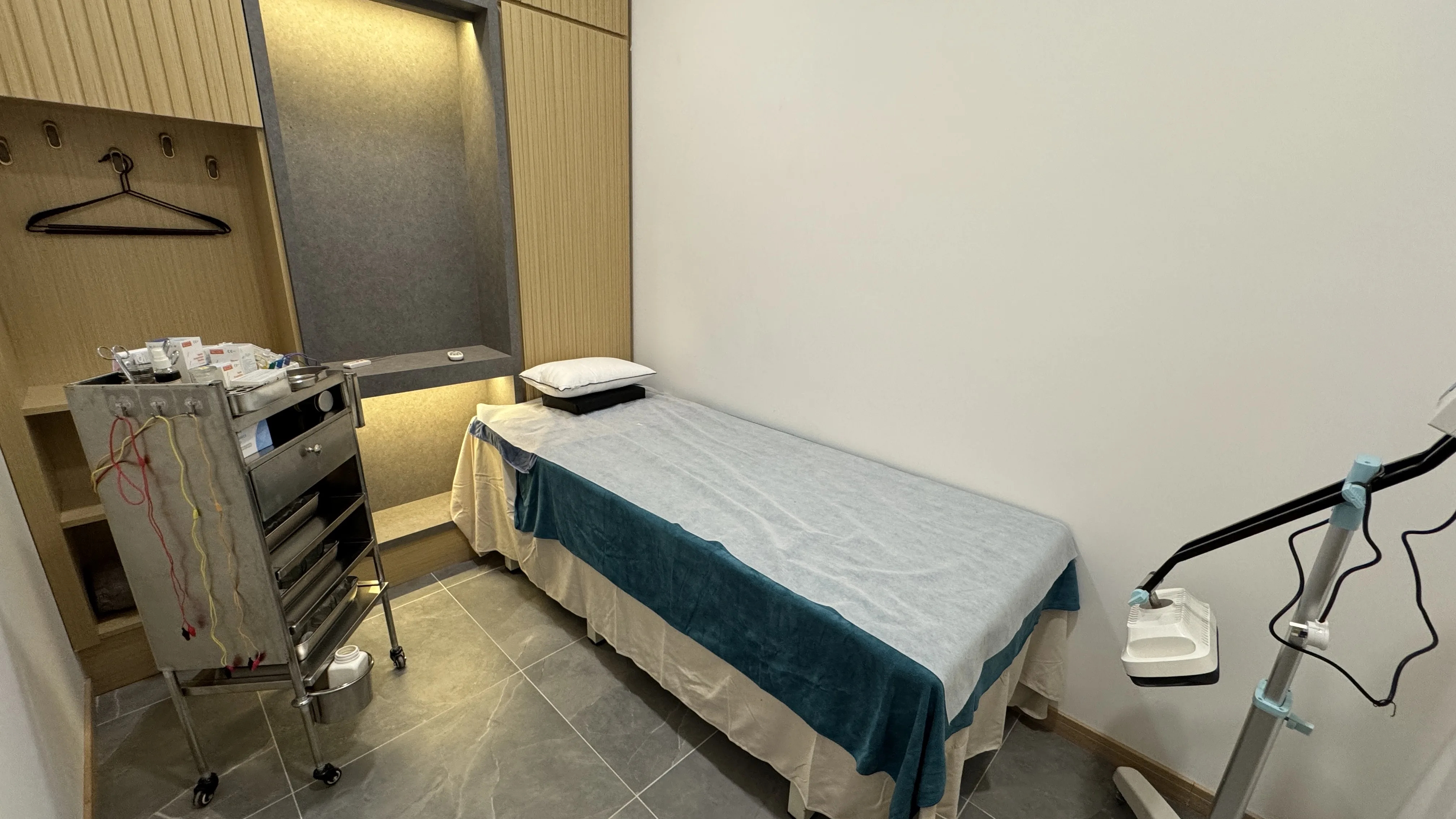 Treatment room with electro-acupuncture leads — clinic interior